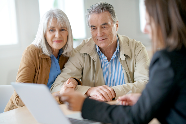 Social worker in discussion with a man and woman